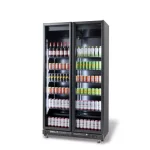 Double-door glass-front beverage cooler stocked with bottles and cans on multiple shelves (commercial fridge).