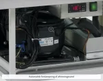 Industrial refrigeration compressor with tangled wires and a digital readout showing 18.1°C.