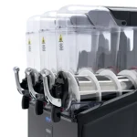 Close-up of an industrial machine with transparent safety hoods and multiple white rollers.