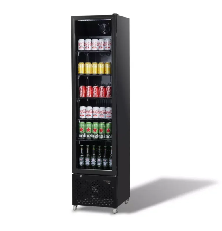 Tall black beverage refrigerator stocked with assorted drinks (cola cans, yellow bottles, red cans, and beer bottles) on multiple shelves in a glass door unit on wheels.